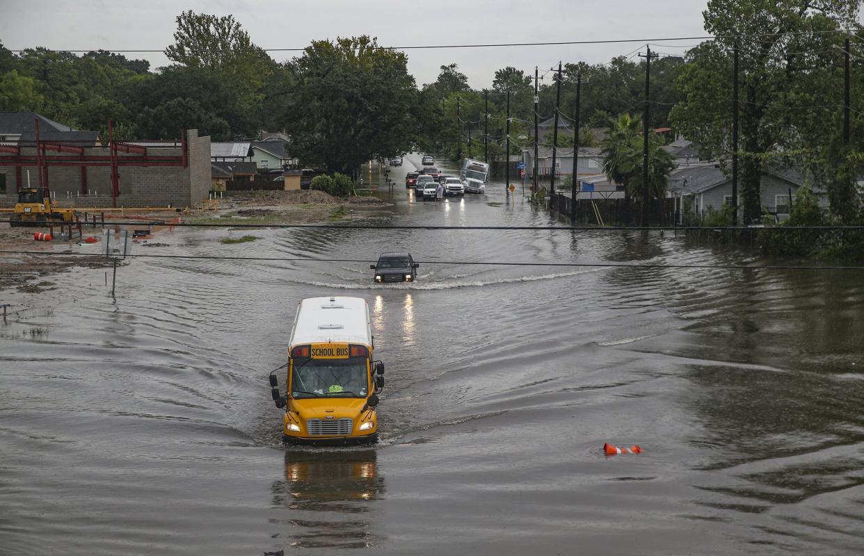 A school bus drives through floodwater in Houston, Texas: Getty Images