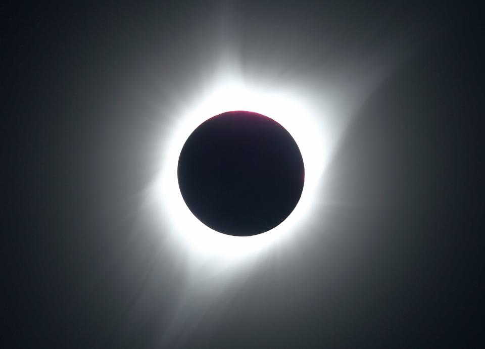 JACKSON, WY - AUGUST 21: The sun is partially eclipsed in the first phase of a total eclipse in Grand Teton National Park on August 21, 2017 outside Jackson, Wyoming. Thousands of people have flocked to the Jackson and Teton National Park area for the 2017 solar eclipse which will be one of the areas that will experience a 100% eclipse on Monday August 21, 2017. (Photo by George Frey/Getty Images)