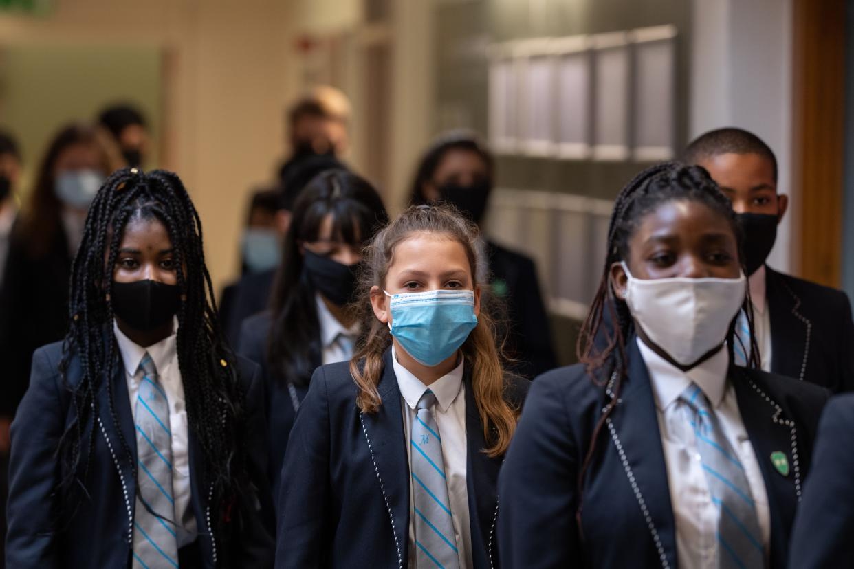 Year eight pupils wear face masks as a precaution against the transmission of the novel coronavirus. (Getty)