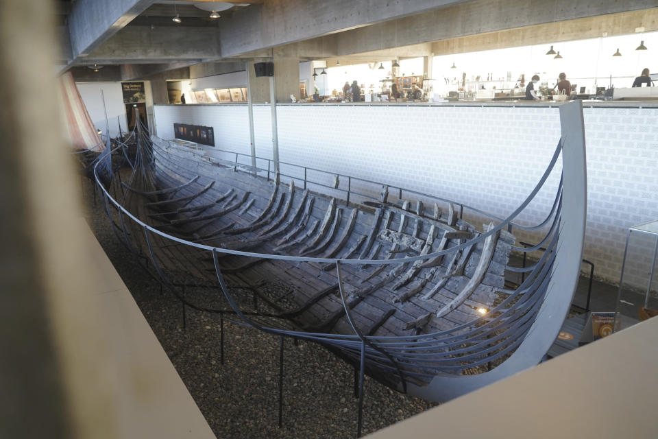 An 11th century, 15-meter Viking ocean-going trading vessel, built in the Nordic clinker boat tradition, sits on display at the Viking Ship Museum. Roskilde, Denmark, Monday, Jan. 17, 2022. For thousands of years, wooden sail boats, best known for having been in use during the Viking-era, allowed the peoples of northern Europe to spread trade, influence and -- in some cases war — across the seas and rivers. In December, UNESCO, the U.N.’s culture agency, added the “clinker’ boat traditions to its list of “Intangible Cultural Heritage,” the result of the first joint nomination from the whole Nordic region. (AP Photo/James Brooks)