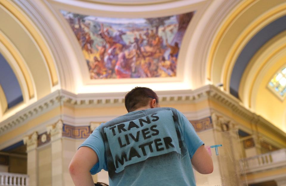 A person wears a Trans Lives Matter shirt on Tuesday during a Trans Oklahomans protest outside of the House chambers during debate on a bill to limit gender transition procedures.
