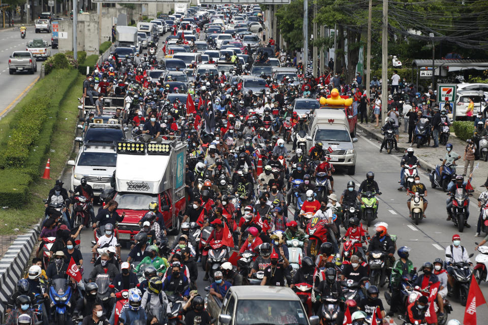 FILE - Anti-government protesters block the road with cars and motorcycles as a part of their "car mob" demonstrations along several roads in Bangkok, Thailand, on Aug. 29, 2021. Cybersecurity researchers have found that Thai activists involved in the country’s pro-democracy protests had their cell phones or other devices infected and attacked with spyware. (AP Photo/Anuthep Cheysakron, File)