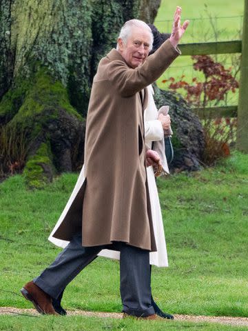 <p>Mark Cuthbert/UK Press via Getty</p> The King gave a wave to photographers on the visit