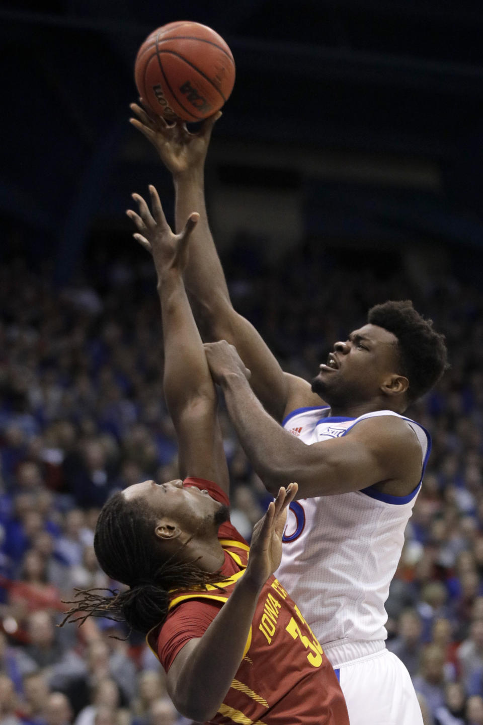 Kansas center Udoka Azubuike (35) shoots over Iowa State forward Solomon Young (33) during the first half of an NCAA college basketball game in Lawrence, Kan., Monday, Feb. 17, 2020. (AP Photo/Orlin Wagner)