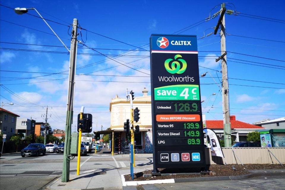 A petrol station showing prices for various fuels.