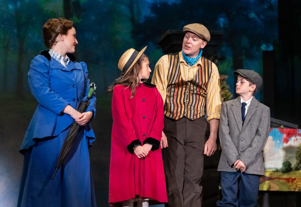 Amber Woollcott as Mary, Sophia Bernard as Jane, Shonn Wiley as Bert and Adrian Stukey as Michael take a walk in the park in a scene from “Mary Poppins” at the Croswell Opera House.