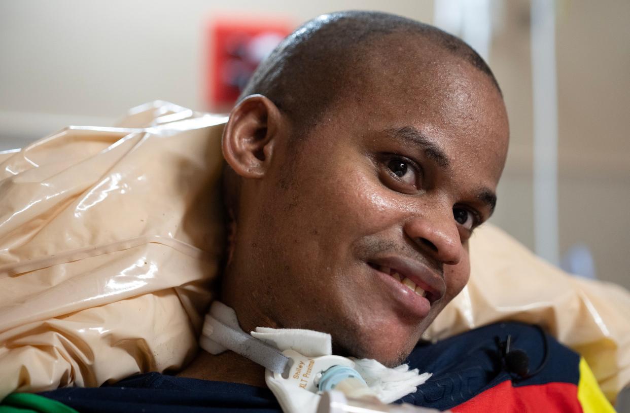 Kassim Omar in her bed at the Far East Columbus nursing home where she's lived for months. The 29-year-old was paralyzed after being shot in the neck in 2022 and has bounced between different nursing homes since being shot, as her family lives in a refugee camp in Kenya.