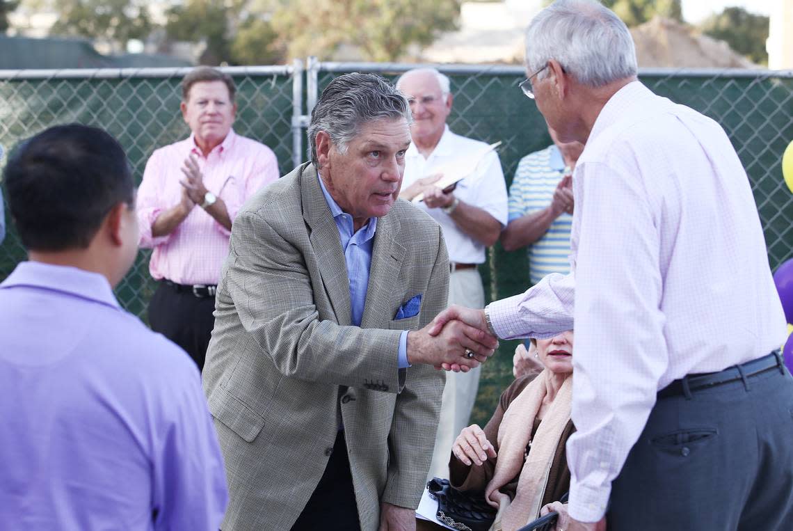 Hall of Fame pitcher Tom Seaver, left, shakes the hand of fellow famous Fresno High alum Dick Ellsworth, who talked during a ceremony to honor Seaver in which the city renamed Echo Avenue “Tom Seaver Lane,” on Friday, Oct. 25, 2013.