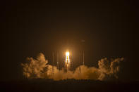 A Long March-5 rocket carrying the Chang'e 5 lunar mission lifts off at the Wenchang Space Launch Center in Wenchang in southern China's Hainan Province, early Tuesday, Nov. 24, 2020. China launched an ambitious mission on Tuesday to bring back material from the moon's surface for the first time in more than 40 years — an undertaking that could boost human understanding of the moon and of the solar system more generally. (AP Photo/Mark Schiefelbein)