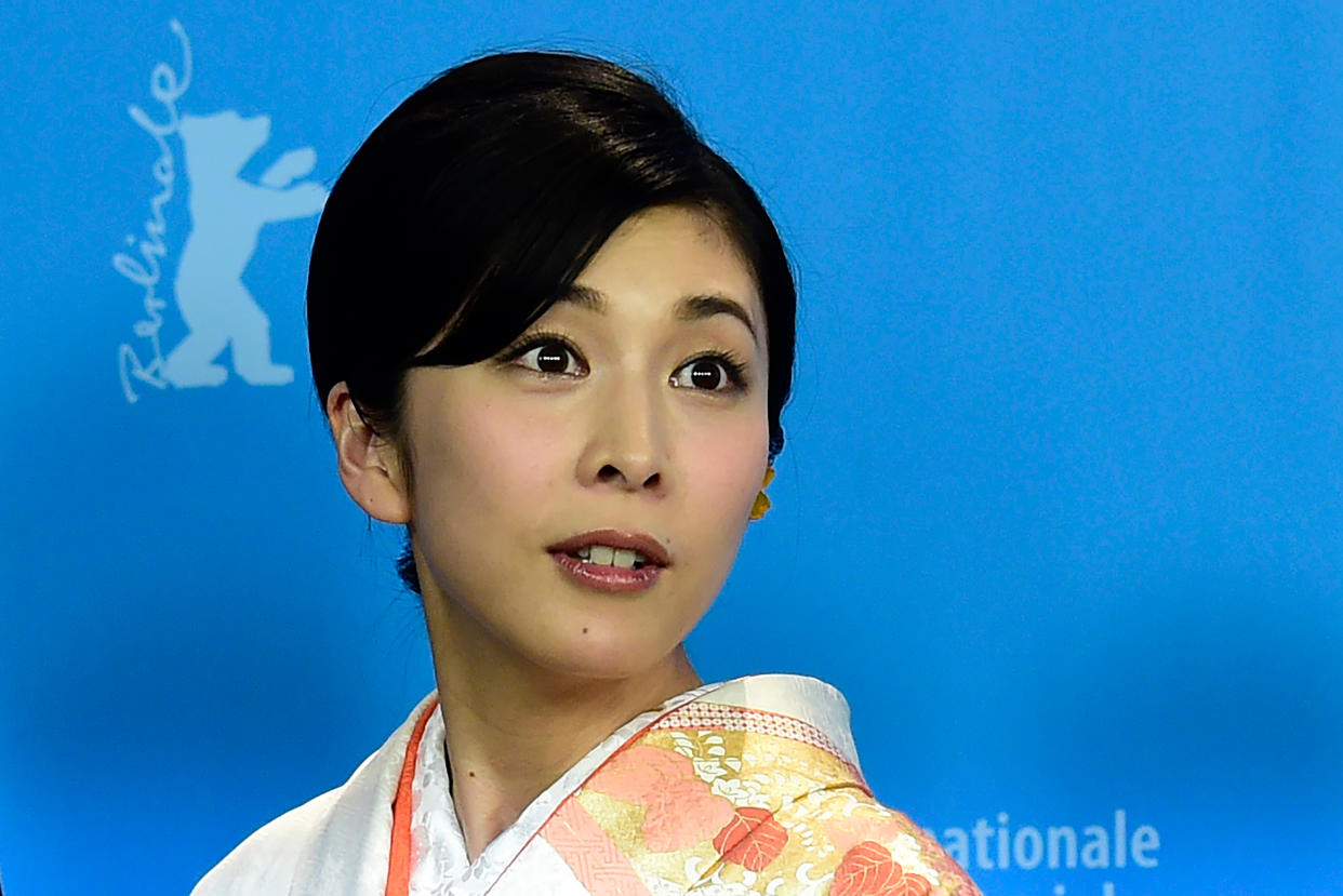 In this picture taken on February 13, 2016 Japanese actress Yuko Takeuchi poses during a photocall for the film "Creepy" at the 66th Berlinale Film Festival in Berlin. - Japan's government on September 28, 2020 urged people to seek help if they were struggling to cope, following the death at the weekend of a popular actress. (Photo by JOHN MACDOUGALL / AFP) (Photo by JOHN MACDOUGALL/AFP via Getty Images)