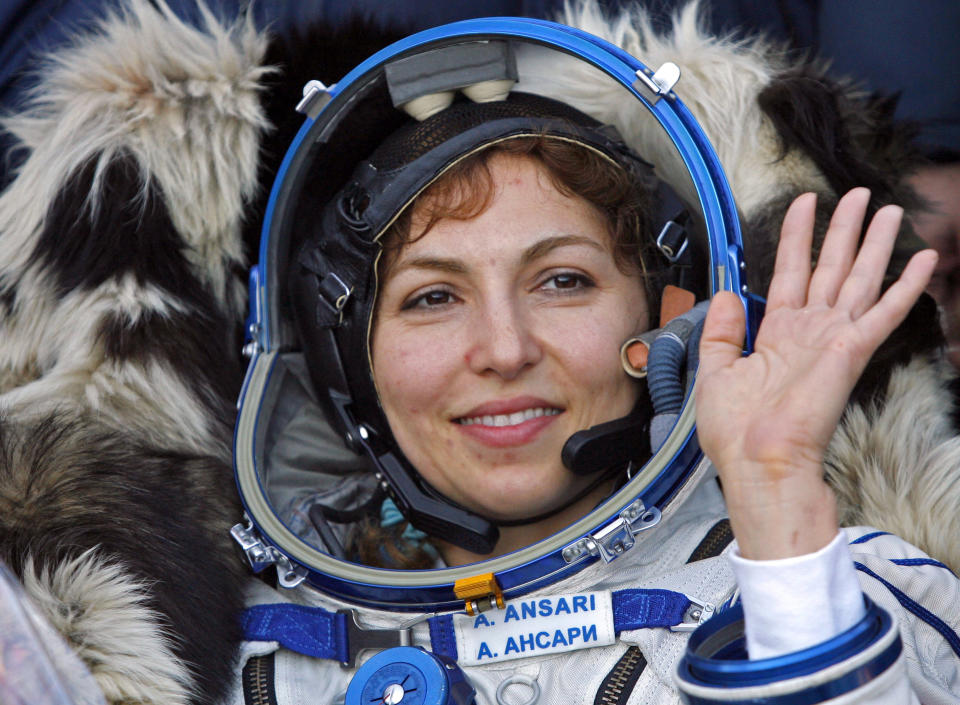 FILE - In this Sept. 29, 2006 file photo, U.S. space tourist Anousheh Ansari waves shortly after landing near the town of Arkalyk, northern Kazakhstan. CEO of the XPRIZE Foundation, Ansari, funded the first prize for $10 million for private space flight. The 2019 XPRIZE, also for $10 million, funded by entrepreneur Elon Musk, presented a challenge: Come up with open-sourced software that could easily be downloaded onto tablets used by illiterate children to teach themselves to read. The winner of this latest competition for global innovation is being announced Wednesday, May 15, 2019, in Los Angeles. (AP Photo/Misha Japaridze, File)