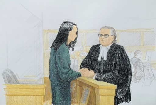 In this courtroom sketch by Jane Wolsak and released to AFP by the artist, Meng Wanzhou (L), Huawei's chief financial officer, speaks with lawyer David Martin in the courtroom in Vancouver, British Columbia in December 2018