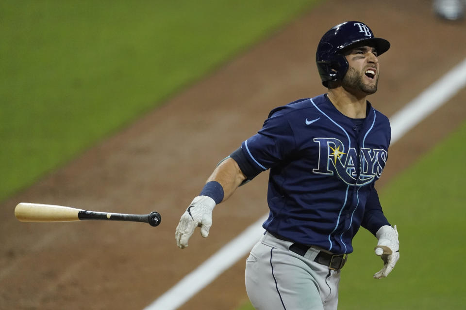 Tampa Bay Rays' Kevin Kiermaier grimaces after being hit by a pitch from Houston Astros pitcher Enoli Paredes during the sixth inning in Game 3 of a baseball American League Championship Series, Tuesday, Oct. 13, 2020, in San Diego. (AP Photo/Ashley Landis)