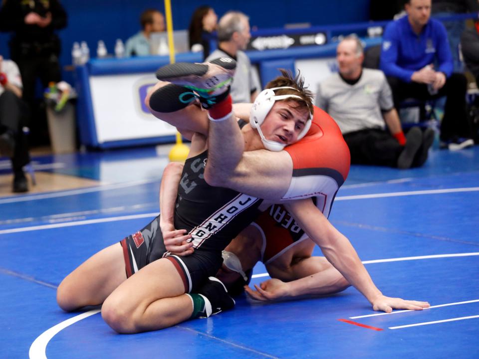 Cohen Bunting takes command of his finals match against East Liverpool Beaver Local's Justin Cox en route to a 19-8 major decision at 165 pounds during the Division II district wrestling tournament on Saturday at Gallia Academy High School in Gallipolis.