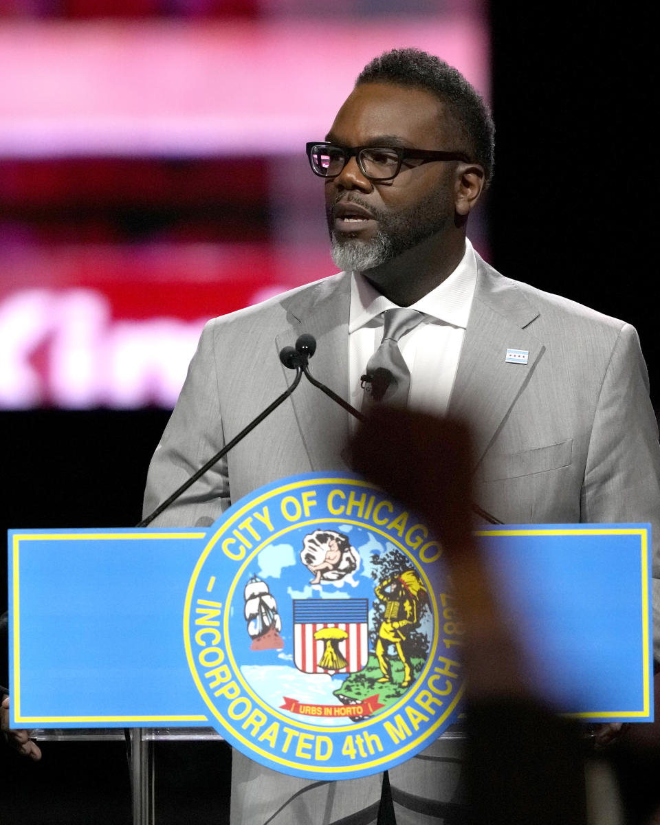 A member of the audience raises their fist as Chicago Mayor Brandon Johnson delivers his inaugural address Monday, May 15, 2023, in Chicago. (AP Photo/Charles Rex Arbogast)