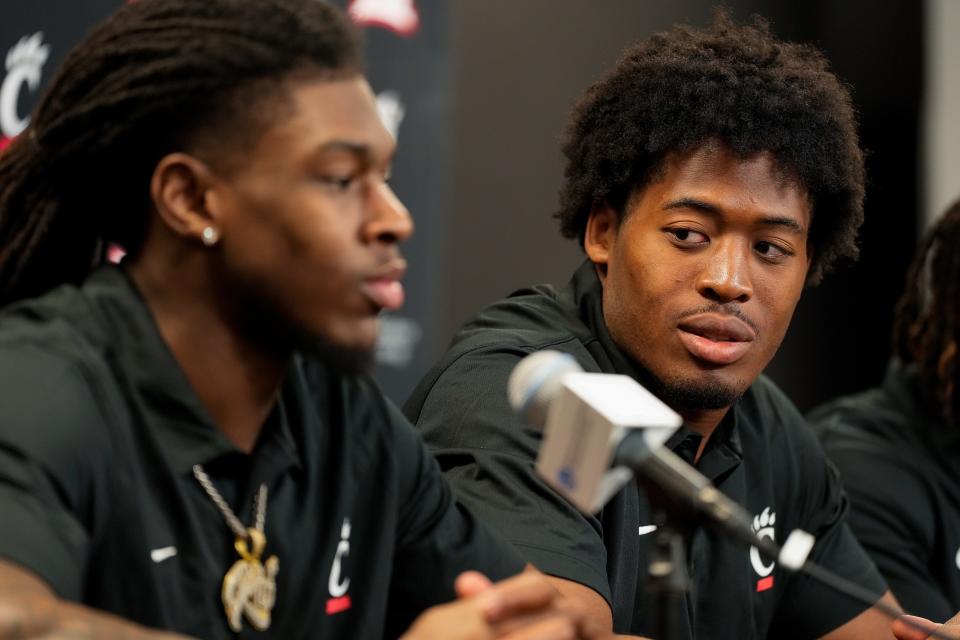 Cincinnati Bearcat transfers Kye Stokes (left) and Jared Bartlett meet the press in Fifth Third Arena last month.