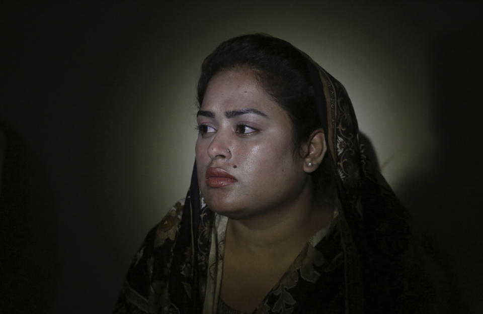 In this May 14, 2019, photo, Pakistani Christian Natasha Masih, speaks to the Associated Press in Faisalabad, Pakistan. Natasha begged her mother to bring her home from China, but it took an elaborate scheme devised by a small cabal of Christian men in her hometown of Faisalabad, in Pakistan's Punjab province, to orchestrate her escape from what began as an unhappy marriage, and ended in prostitution. (AP Photo/K.M. Chaudary)