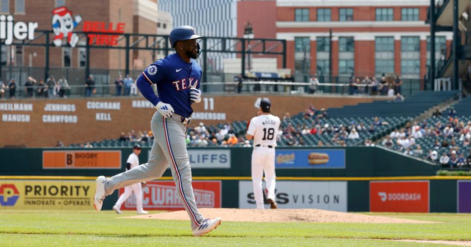 Texas Ranger Adolis Garcia heads down the third base line after hitting a home run off of Detroit Tigers starting pitcher (in the background) Kenta Maeda during the game between the Detroit Tigers and the Texas Rangers at Comerica Park in Detroit on Thursday, April 18, 2024.
The Tigers lost the game 9-7.