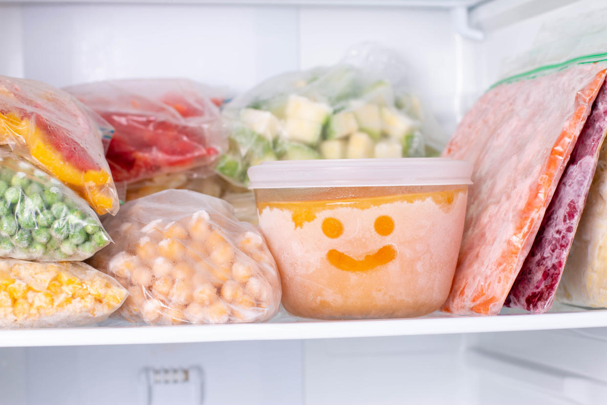 Frozen food in the freezer. Frozen vegetables, soup, ready meals in the freezer