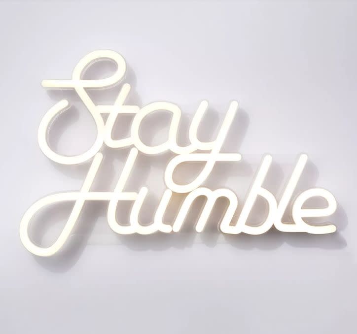 This "Stay Humble" neon sign would make the perfect edition to a living room or home office. <strong><a href="https://fave.co/322WA3B" target="_blank" rel="noopener noreferrer">Find it for $25 at Target</a>.</strong>