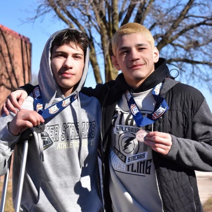 Gauge Shipp, left, and Rocky Almendarez, show of their state medals in this photo taken February 2024.