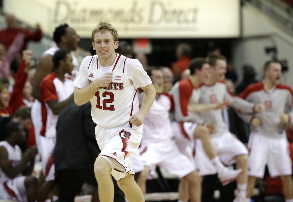 North Carolina State's Tyler Lewis (12) reacts during the second half of an NCAA college basketball game against North Carolina in Raleigh, N.C., Wednesday, Feb. 26, 2014. North Carolina won 85-84 in overtime.