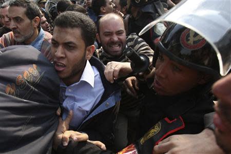 Protesters from the Muslim Brotherhood clash with riot police outside the Egyptian Parliament in Cairo, as they demonstrate against Israeli attacks against Hamas-ruled Gaza, in this December 28, 2008 file photo. REUTERS/Amr Abdallah Dalsh/Files