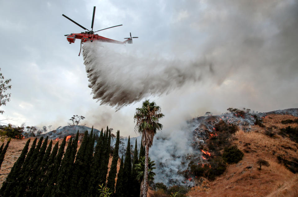 A helicopter fights the fire