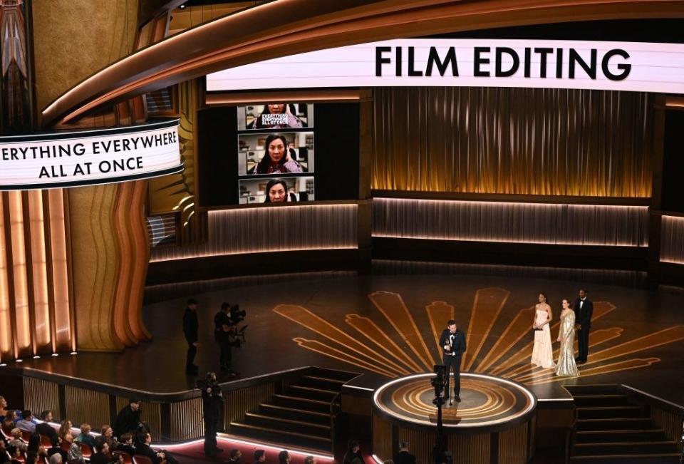 Paul Rogers accepts the Oscar for Best Film Editing for "Everything Everywhere All at Once" onstage