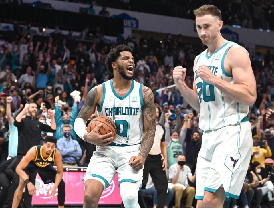 Charlotte Hornets forward Miles Bridges, center, begins the celebration as forward Gordon Hayward, right, joins in following the teamÕs victory over the Indiana Pacers 123-122 at Spectrum Center in Charlotte, NC on Wednesday, October 20, 2021.