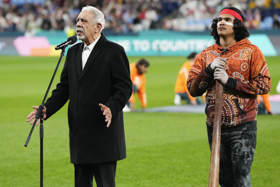 Aboriginals perform a Welcome to Country ceremony ahead of the Women's World Cup Group D soccer match between England and Denmark at the Sydney Football Stadium in Sydney, Australia, Friday, July 28, 2023. More than any of the previous tournaments, the Women's World Cup in Australia and New Zealand has leaned into including and showcasing the Indigenous cultures of both nations. (AP Photo/Mark Baker)