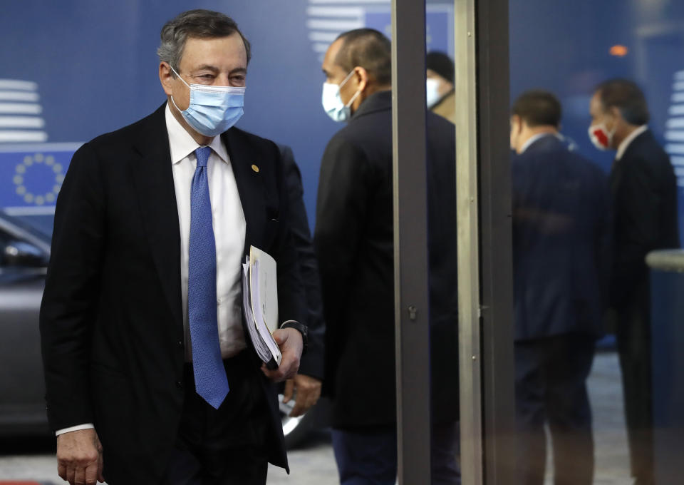 Italy's Prime Minister Mario Draghi arrives for an EU summit in Brussels, Friday, Oct. 22, 2021. European Union leaders conclude a two-day summit on Friday in which they discuss issues such as climate change, the energy crisis, COVID-19 developments and migration. (Olivier Hoslet, Pool Photo via AP)