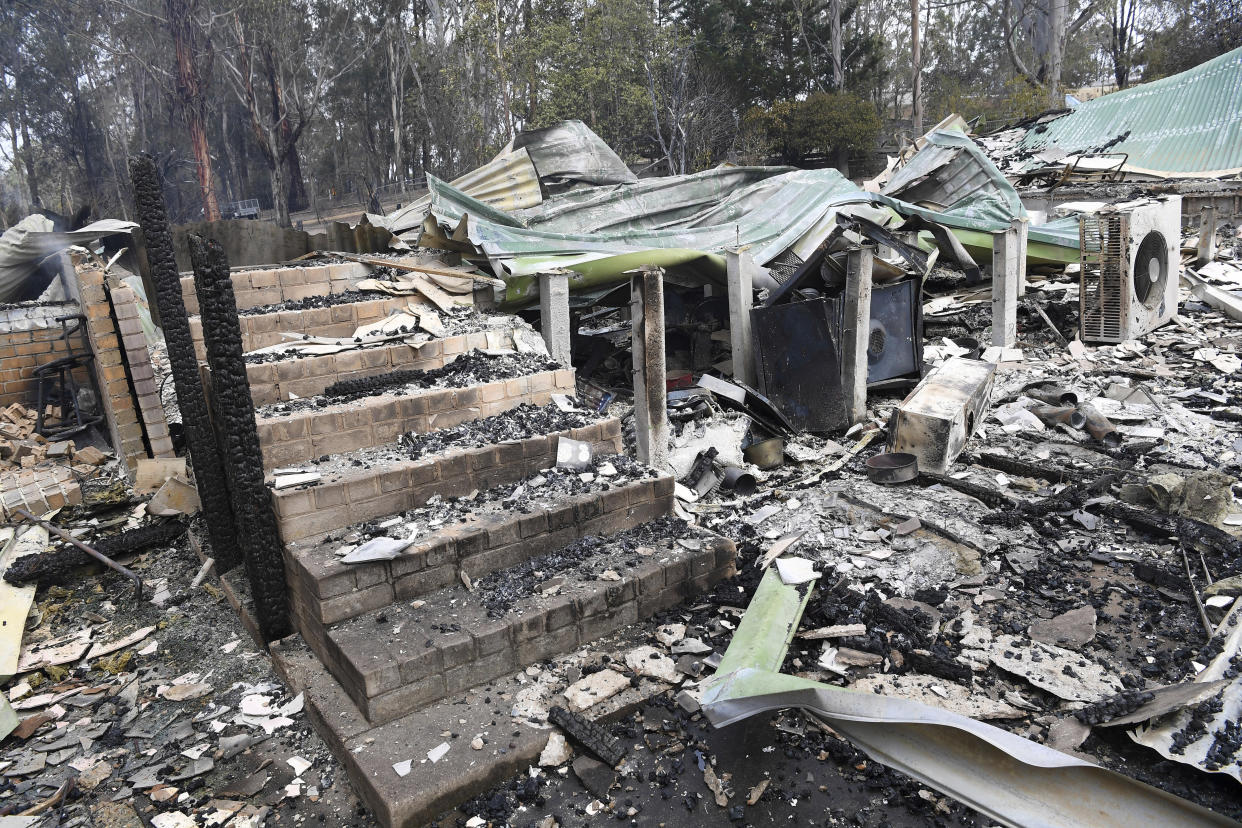 A burnt-out residence is seen in Sarsfield, East Gippsland, Victoria,.