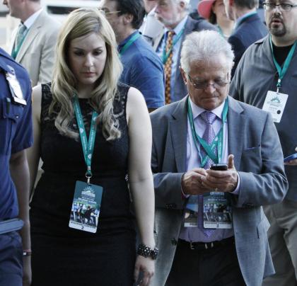 California Chrome trainer Art Sherman, right, walks in the barn area at Belmont park. (AP)