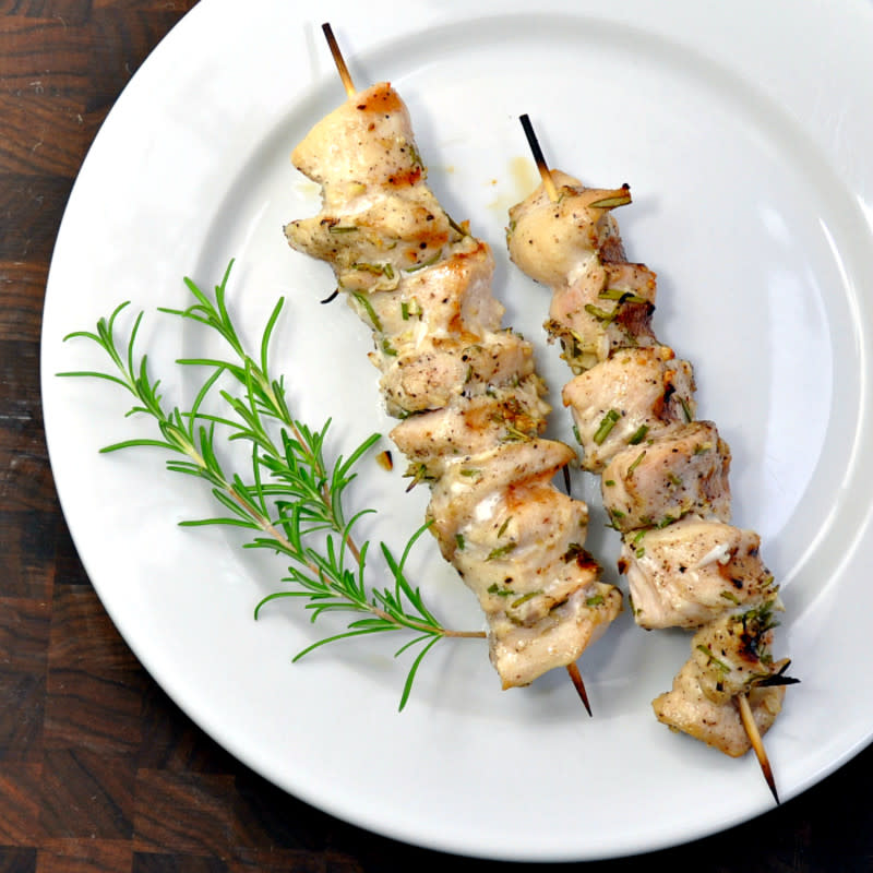 <p>Pinch and Swirl</p><p>Chicken kebabs offer a light, classy, and delicious option for your graduation party this year. Simple and affordable too...they really have it all!</p><p><strong>Get the recipe: <a href="http://pinchandswirl.com/2013/08/rosemary-garlic-chicken-kabobs/" rel="nofollow noopener" target="_blank" data-ylk="slk:Rosemary Garlic Chicken Kabobs;elm:context_link;itc:0;sec:content-canvas" class="link rapid-noclick-resp">Rosemary Garlic Chicken Kabobs</a></strong></p>