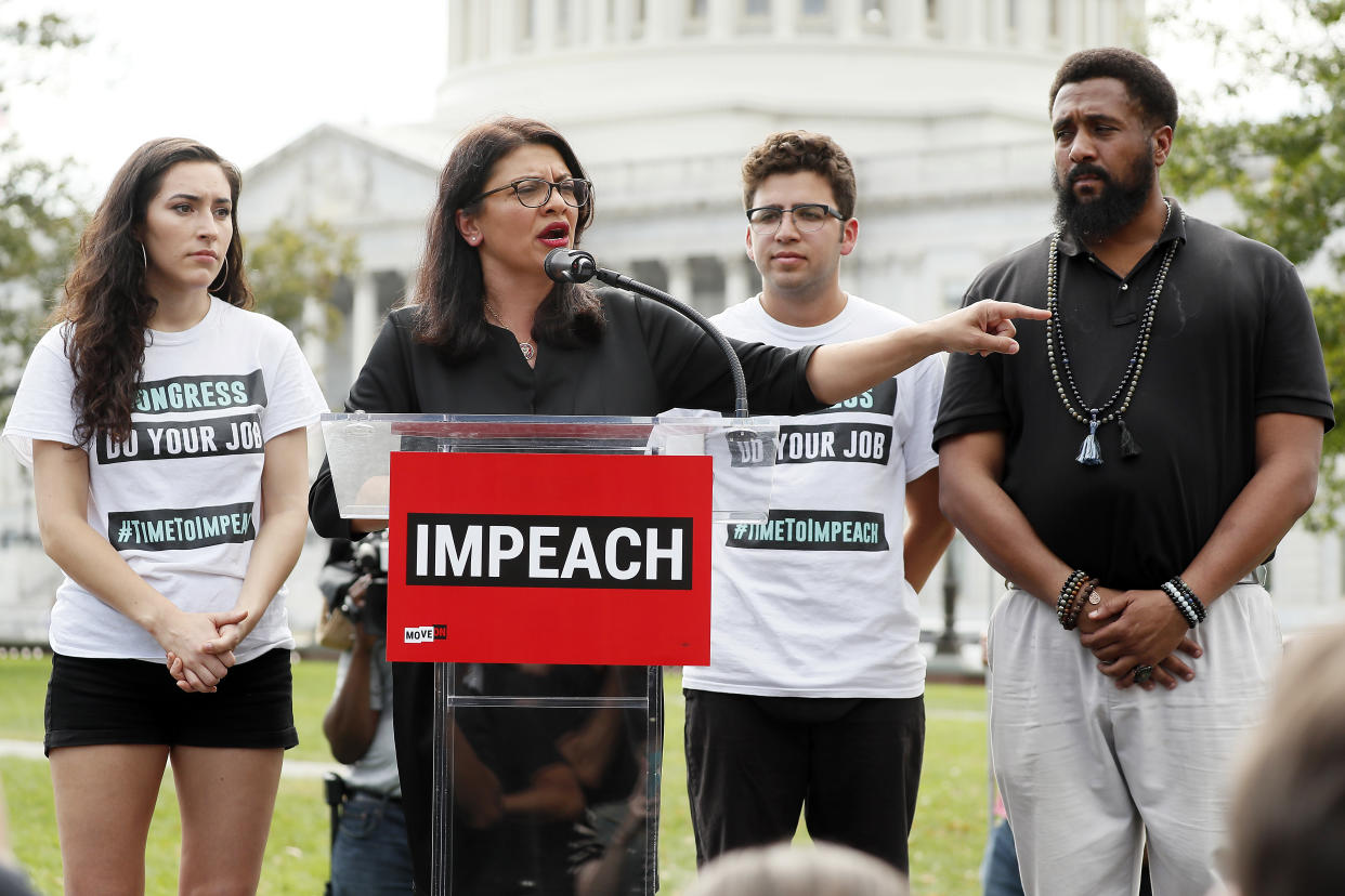 Rep. Rashida Tlaib, D-Mich., center, at the "Impeachment Now!" rally in Washington, D.C., on Sept. 26. (Photo: Paul Morigi/Getty Images for MoveOn Political Action)