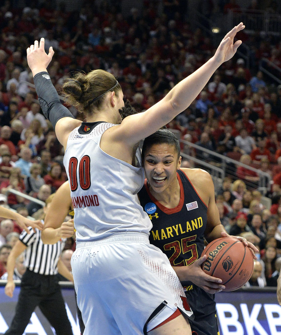 Maryland's Alyssa Thomas attempts to duck under the defense of Louisville's Sara Hammond during the first half of a regional final in the NCAA women's college basketball tournament, Tuesday, April 1, 2014, in Louisville, Ky. (AP Photo/Timothy D. Easley)