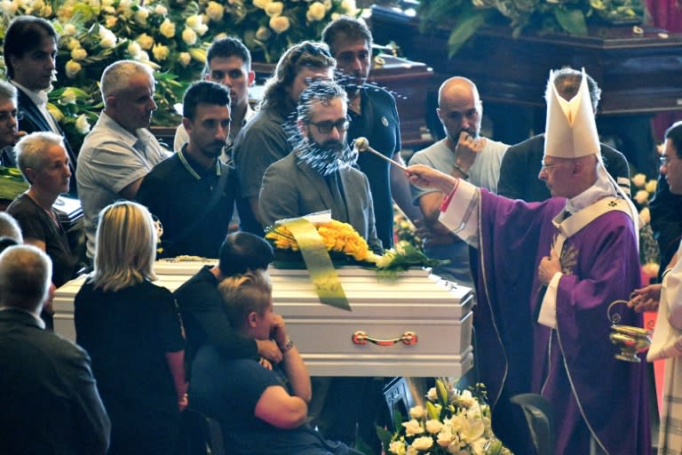 Archbishop Angelo Bagnasco blessed the coffins during the state funeral for victims of the Morandi bridge collapse