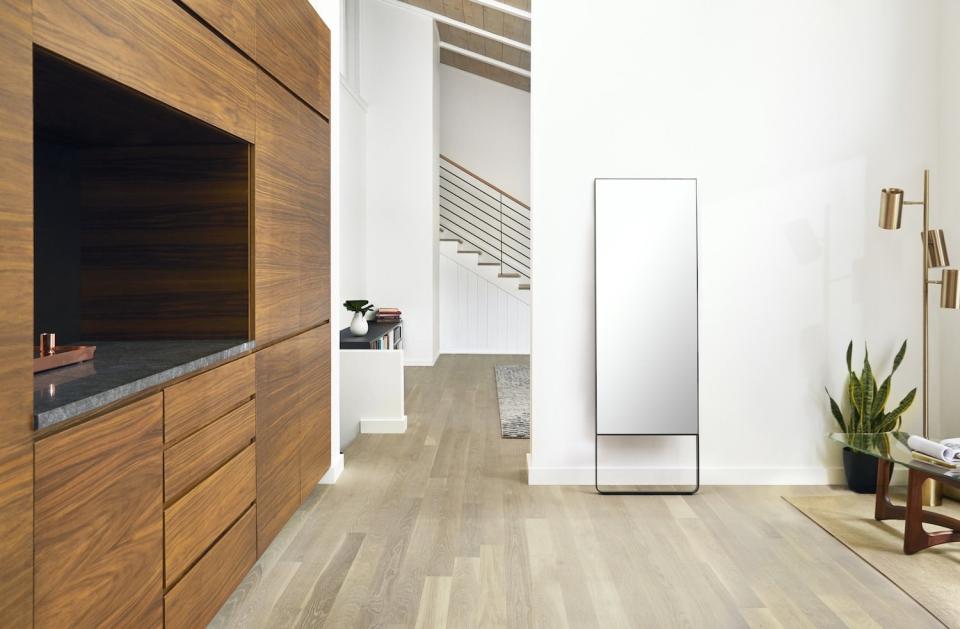 When not in use, Mirror looks and acts just like a normal full-length mirror, and can be mounted on the wall or sit on the floor.