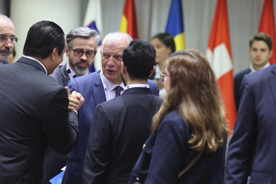 European Union foreign policy chief Josep Borrell, center left, shakes hands with attendees during a meeting 'Supporting the future of Syria and the region' at the European Council building in Brussels, Thursday, June 15, 2023. Aid agencies will struggle to draw the world's attention back to Syria at an annual donor conference hosted by the European Union in Brussels for humanitarian aid to Syrians. (AP Photo/Geert Vanden Wijngaert)