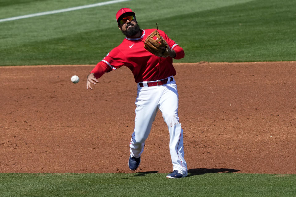 Los Angeles Angels' Anthony Rendon fields a ground out hit by San Diego Padres' Matthew Batten during the third inning of a spring training baseball game, Friday, March 24, 2023, in Tempe, Ariz. (AP Photo/Matt York)