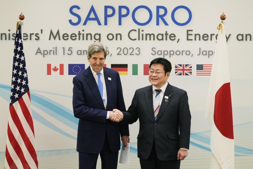 U.S. Special Presidential Envoy for Climate John Kerry and Japan's Environment Minister Akihiro Nishimura shake hands before their bilateral meeting in the G-7 ministers' meeting on climate, energy and environment in Sapporo, northern Japan, Saturday, April 15, 2023. (AP Photo/Hiro Komae)