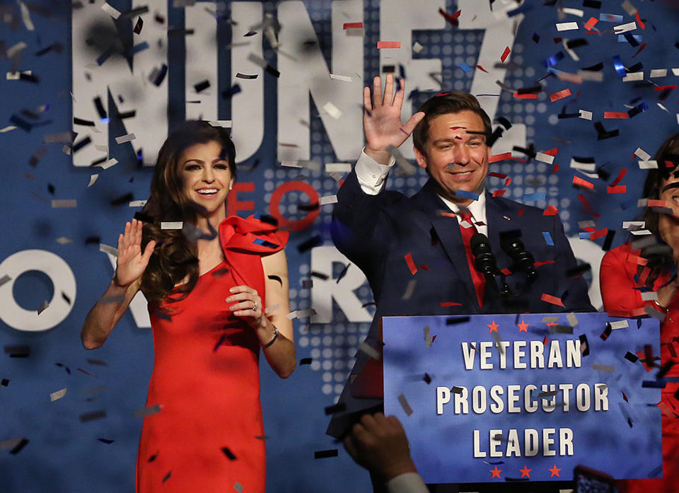 Ron DeSantis and his wife, Caey, celebrate after winning the Florida Governor's race during DeSantis' party at the Rosen Centre in Orlando, Fla., on Tuesday, Nov. 6, 2018. (Stephen M. Dowell/Orlando Sentinel/TNS via Getty Images)