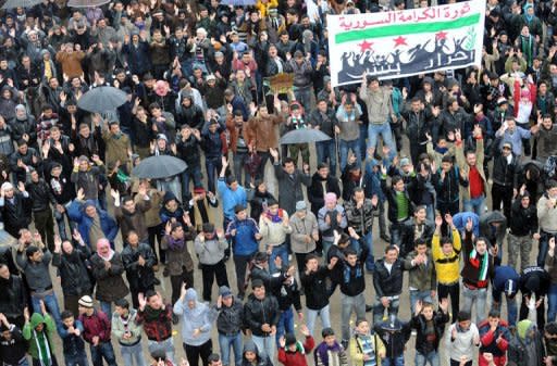 Syrians demonstrate against the regime after Friday prayers in the north Syrian city of Idlib. Thousands of Syrians rallied Friday for Bashar al-Assad's ouster, as the embattled president's forces unleashed their heaviest pounding yet of Homs in a brutal bid to crush dissent, monitors said