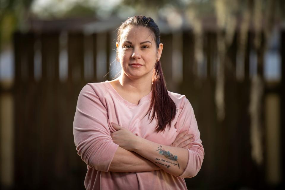 Sarah Duckett, a former patient of Dr. Katharine Roxanne Grawe, stands outside her Florida home. Duckett traveled from the Tampa area to Columbus for a procedure under the plastic surgeon more commonly known online as "Dr. Roxy."