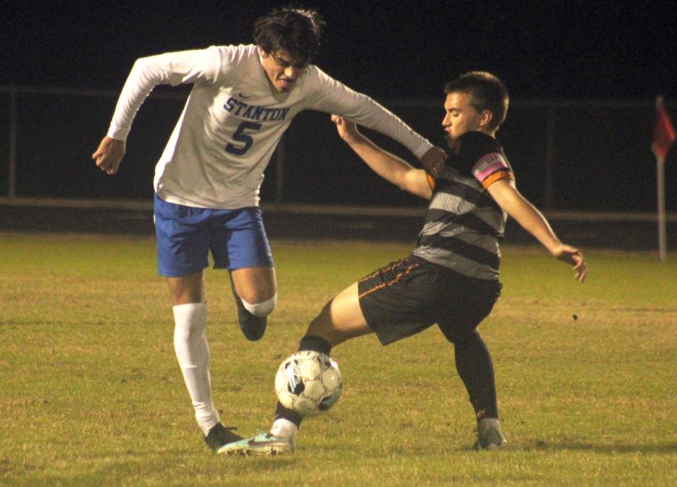 Stanton midfielder Ethan Breslin (5) and Atlantic Coast midfielder Smyth Gover (8) challenge for possession during a Gateway Conference high school boys soccer semifinal.