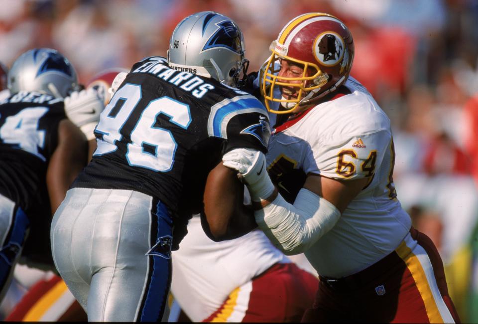 Andy Heck #64 of the Washington Redskins pushes back Antonio Edwards #96. The Redskins defeated the Panthers 38-36.