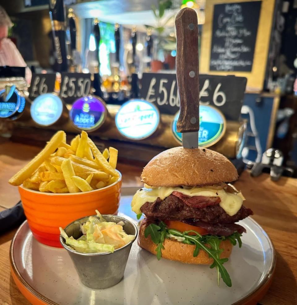 Eastern Daily Press: Burger and chips from The Rose & Crown in Harpley Picture: Andrew Waddison / AW PR