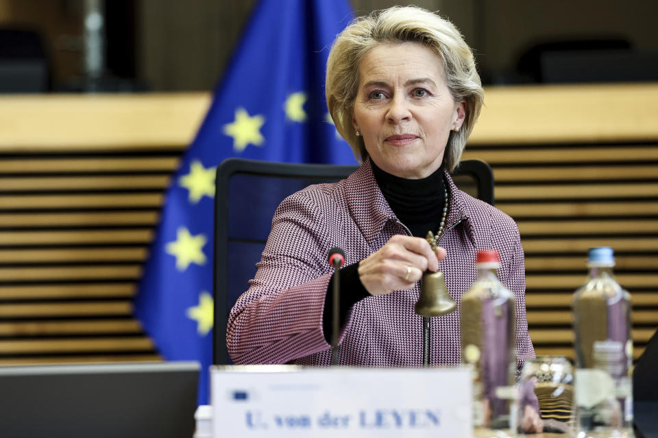 European Commission President Ursula von der Leyen rings a bell to signal the start of the European Commission weekly College Meeting at EU headquarters in Brussels, Wednesday, March 30, 2022. The European Union is warning consumers to stop using their clothing like throwaway tissues and is planning measures to counter the spiraling use of polluting "fast fashion." (Kenzo Tribouillard, Pool Photo via AP)