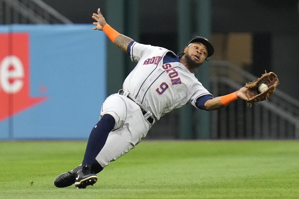 Houston Astros left fielder Corey Julks makes a sliding catch for the out on Chicago White Sox's Gavin Sheets during the fourth inning of a baseball game Saturday, May 13, 2023, in Chicago. (AP Photo/Erin Hooley)